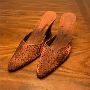 Imported custom brown beaded mules.